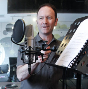 Andy Wells setting up a microphone for the voice over course